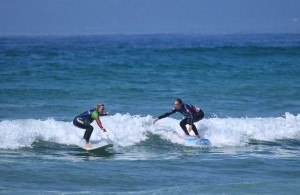 The girls enjoying Muizenberg surf.